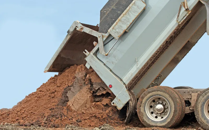 Dump truck unloading a load